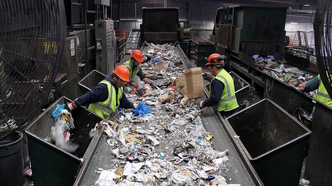 Crew preventing waste at workplace