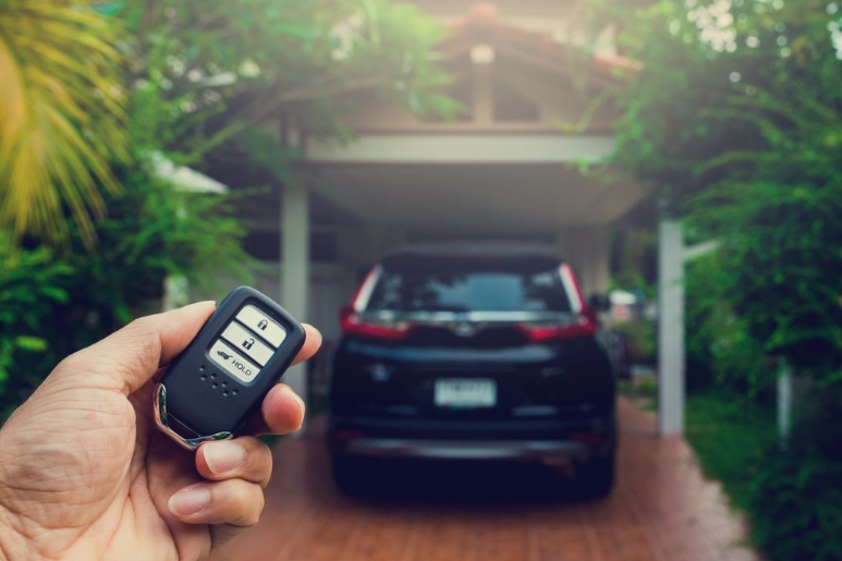 Car owner checking vehicle security system