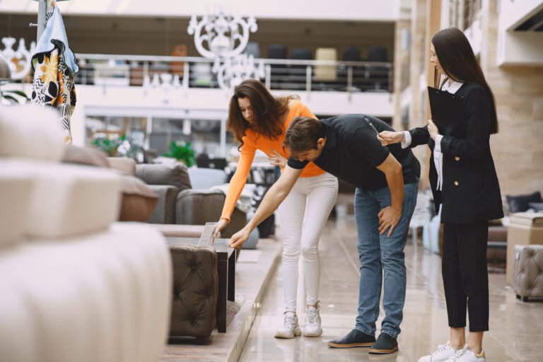 A couple checking Useful Pieces of Furniture for a Home